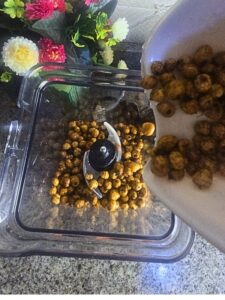 Pour Nigerian tiger nuts into the blender